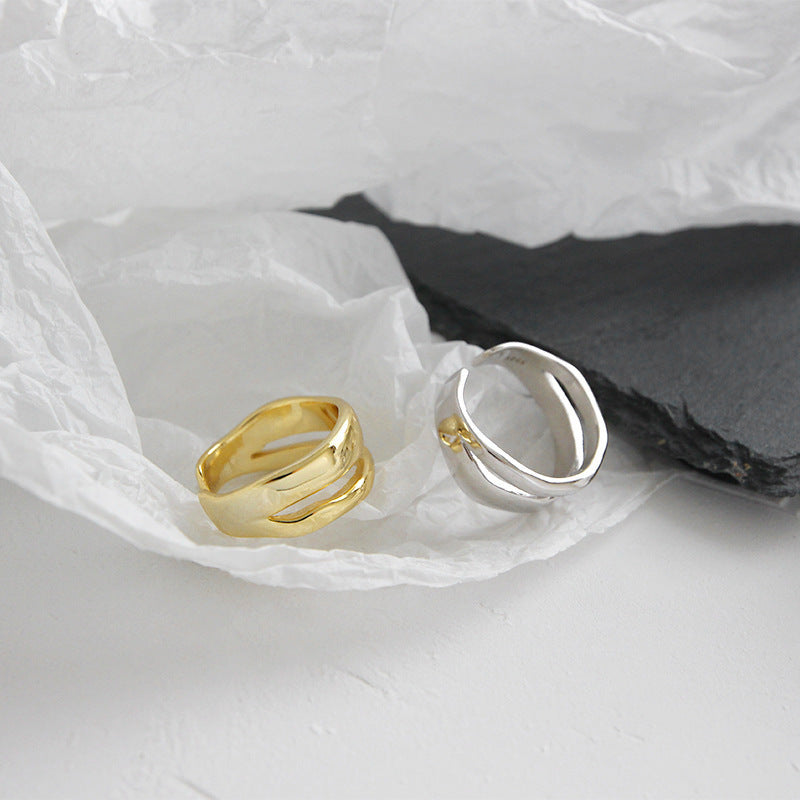 Gold and silver rings on a white fabric background