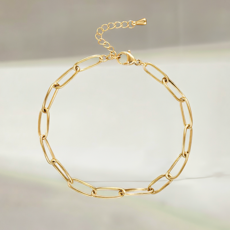 Gold link bracelet on a light background