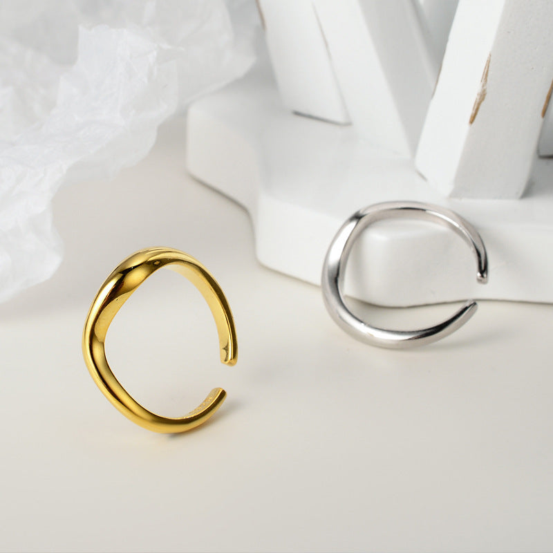Gold and silver rings on a white fabric background
